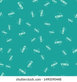 Green Skateboard trick icon isolated seamless pattern on green background. Extreme sport. Sport equipment.  Vector Illustration