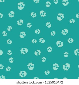 Green Skull icon isolated seamless pattern on green background. Happy Halloween party.  Vector Illustration