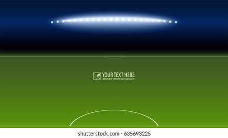 Green soccer field from the goalkeeper area with the spotlights with copy-space for your text or message. Lighted football field, horizontal image with aspect HD video.