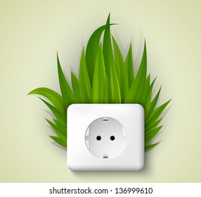 Green socket with grass. the concept of clean energy