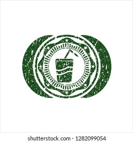Green soda icon inside distressed rubber stamp