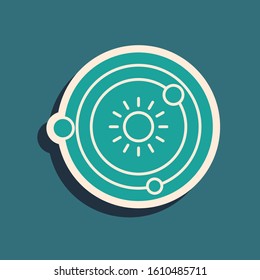 Green Solar system icon isolated on blue background. The planets revolve around the star. Long shadow style. Vector Illustration