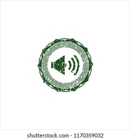 Green sound icon inside rubber grunge texture seal