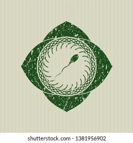 Green sperm icon inside distress rubber grunge stamp