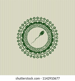 Green sperm icon inside distressed rubber texture