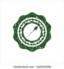 Green sperm icon inside distressed with rubber seal texture