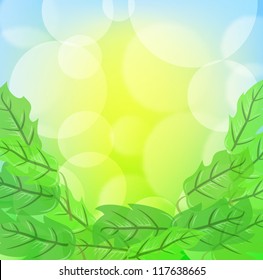 Green spring background with leafage and blurry light