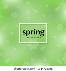 Green spring blurred bokeh background with leaves.