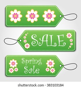 Green spring sale tags collection with flower pattern and hangers. Sale promotion and gift card vectors in different shapes.