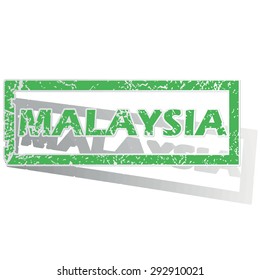 Green stamp with name Malaysia and shadow, isolated on white