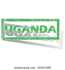 Green stamp with name Uganda and shadow, isolated on white