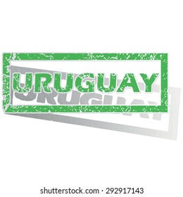 Green stamp with name Uruguay and shadow, isolated on white