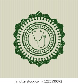Green stethoscope icon inside rubber stamp with grunge texture