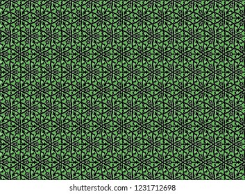 green stylized floral pattern on a black background