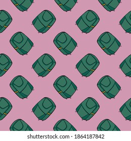 Maletas verdes, sin costura sobre fondo morado.