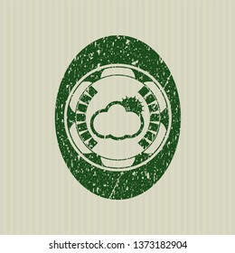 Green sun behind cloud icon with rubber seal texture