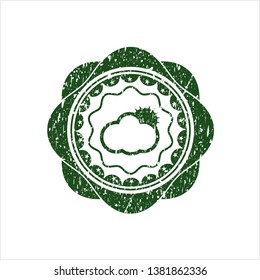 Green sun behind cloud icon inside rubber seal with grunge texture