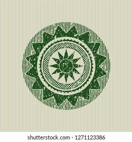 Green sun icon inside distress with rubber seal texture