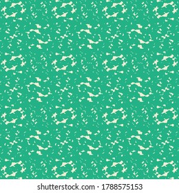 Green surface marked with white abstract signs and different flecks. Wallpaper texture. Textile design.