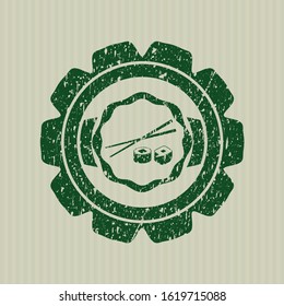 Green sushi icon inside distressed rubber seal