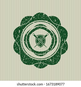 Green swords crossed with shield icon inside distress rubber grunge texture seal