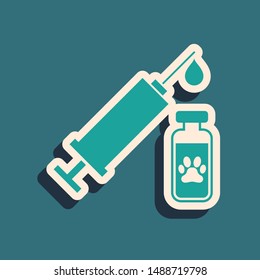 Green Syringe with pet vaccine icon isolated on blue background. Dog or cat paw print. Long shadow style. Vector Illustration