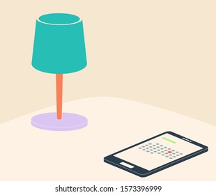 Green table lampe with smartphone on the table