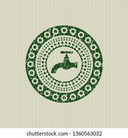 Green tap icon inside distressed rubber grunge texture seal