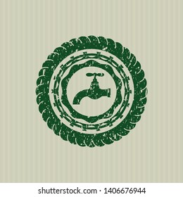 Green tap icon inside distressed grunge seal