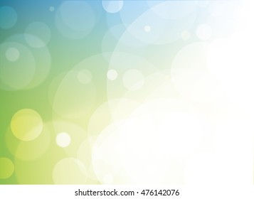 Green, teal, blue and yellow vector blurred bokeh background with clear open white light area. Shows luminosity and layered effects with transparent circles
