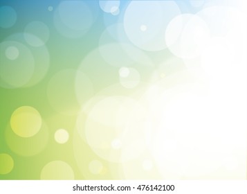 Green, teal, blue and yellow vector blurred bokeh background with clear open white light area. Shows luminosity and layered effects with transparent circles