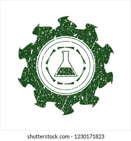 Green test tube icon inside rubber grunge texture seal