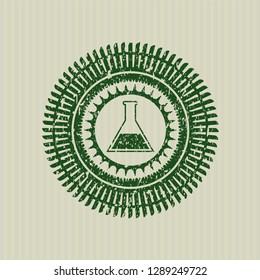 Green test tube icon inside distressed rubber seal with grunge texture