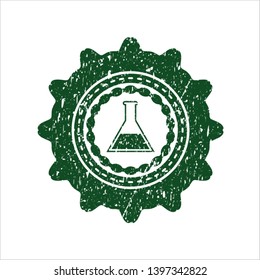 Green test tube icon inside rubber grunge stamp