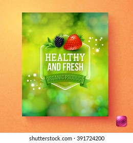 Green themed healthy and fresh organic product label graphic with single blackberry and strawberry over orange background and pink square