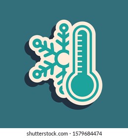 Green Thermometer with snowflake icon isolated on blue background. Long shadow style. Vector Illustration