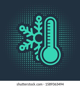 Green Thermometer with snowflake icon isolated on blue background. Abstract circle random dots. Vector Illustration