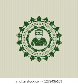 Green thief icon inside distress grunge seal