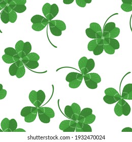 Green three-leaves and four-leafed clover leaves seamless pattern. Vector illustration in cartoon flat style. Saint Patrick's Day background.