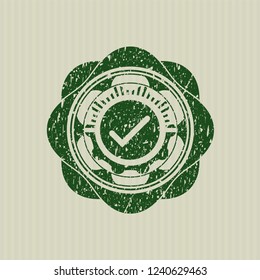 Green tick icon inside distress rubber seal with grunge texture