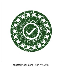 Green tick icon inside distress rubber seal with grunge texture