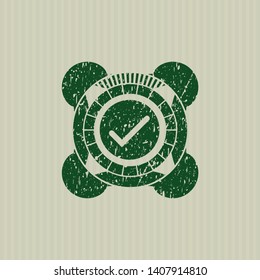 Green tick icon inside distress with rubber seal texture