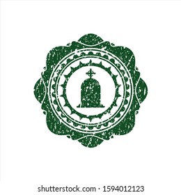 Green tombstone icon inside rubber stamp