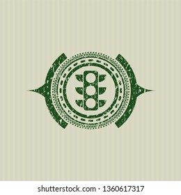 Green traffic light icon inside distressed grunge style stamp