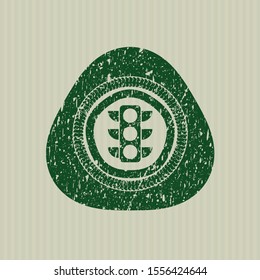 Green traffic light icon inside rubber stamp