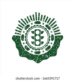 Green traffic light icon inside distress rubber seal