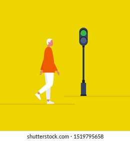 Green traffic light. Young male pedestrian crossing the road. Safety. Flat editable vector illustration, clip art