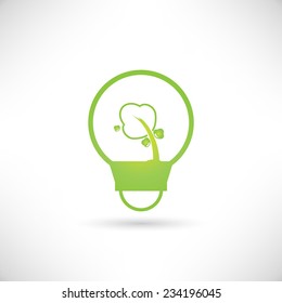 green tree growing in a bulb, go green concept