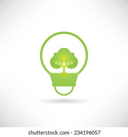green tree growing in a bulb, go green concept
