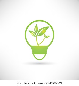 green tree growing in a bulb, go green concept